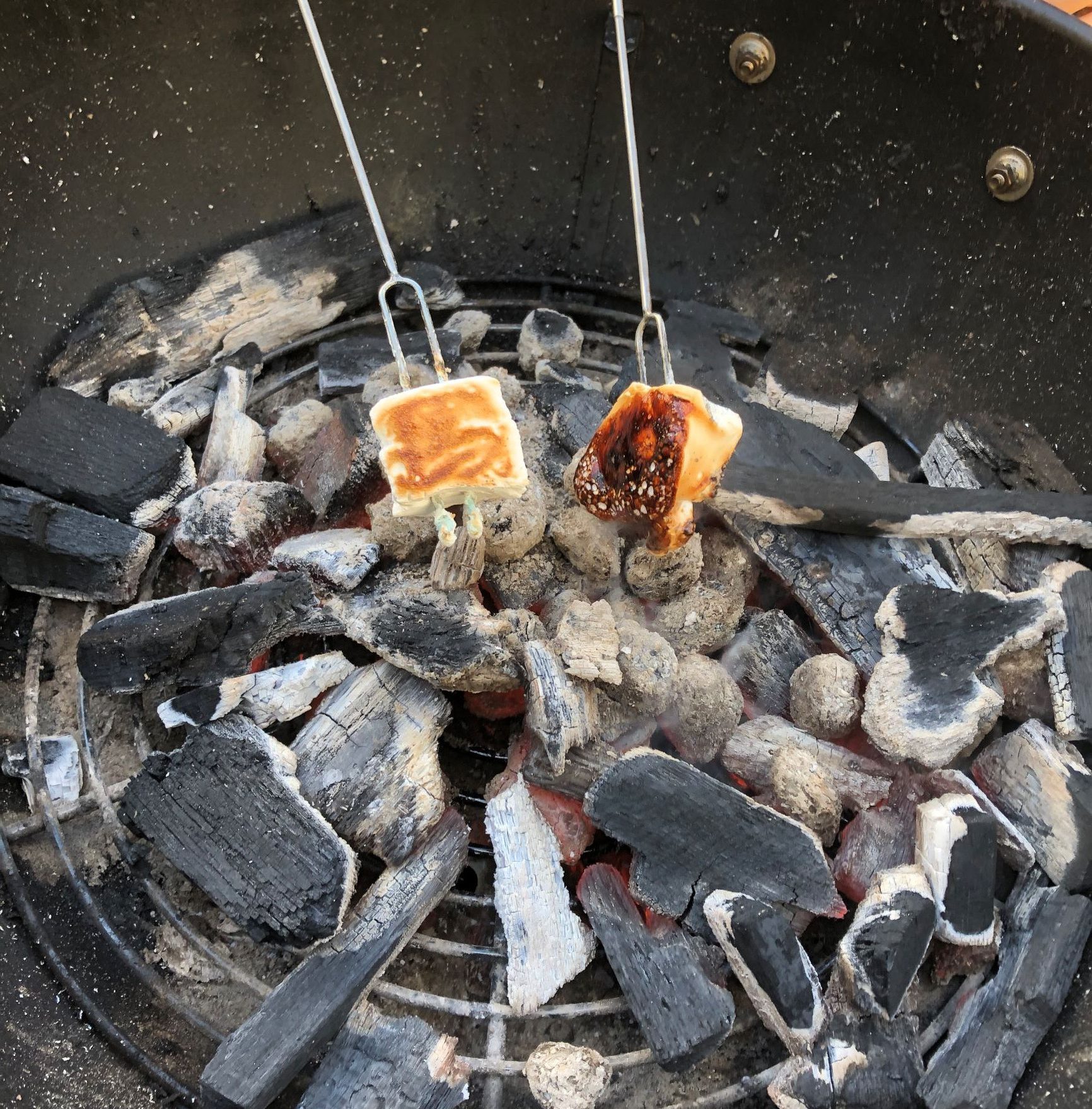 Roasted homemade Campfire Marshmallow over charcoal