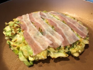 Okonomiyaki Pork Belly laid on Cabbage Patty
